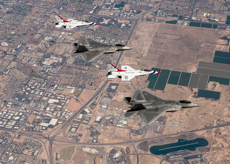 Illustration for article titled These Photos Of Thunderbirds F-16s Flying With F-22 Raptors Is A Whole Lot Of America